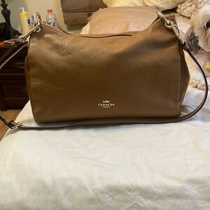 Coach Mia camel-colored handbag. Excellent condition save for scuffing on bottom